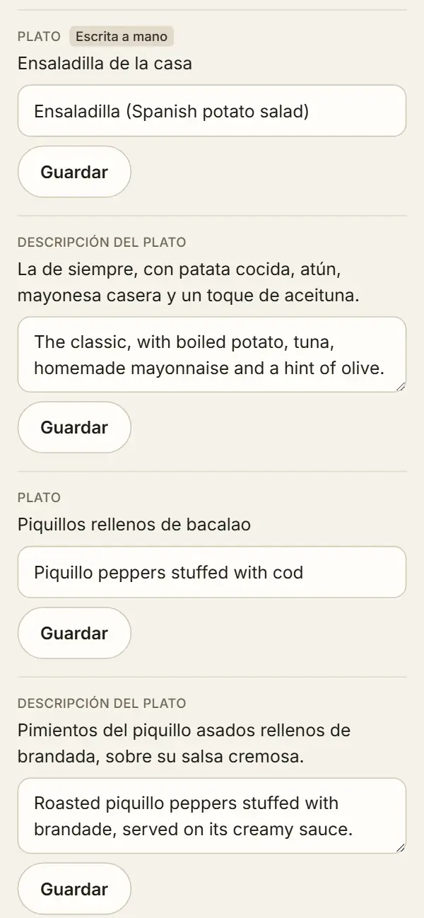 Panel de idiomas en el móvil: «Ensaladilla de la casa» con la traducción corregida a mano, Ensaladilla (Spanish potato salad), y la etiqueta «Escrita a mano»